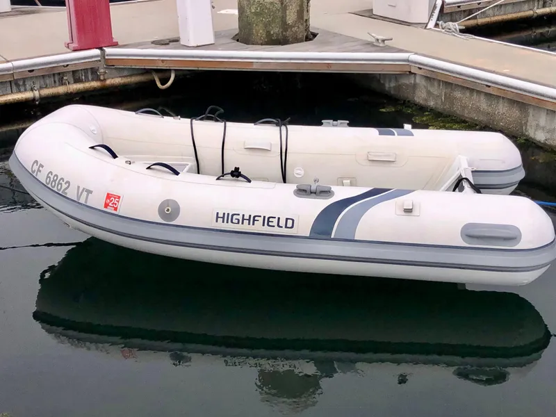 Slide: The Image of Inflatable Highfield boat docked near a Sea Ray 360 Sundancer, 2002 model. - 15