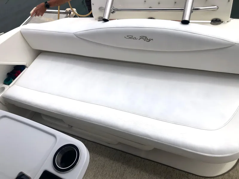 Slide: The Image of 2002 Sea Ray 360 Sundancer white cushioned seating area on deck. - 16