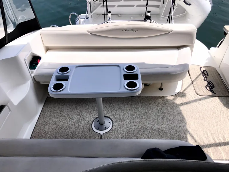 Slide: The Image of 2002 Sea Ray 360 Sundancer boat interior with seating and table. - 18