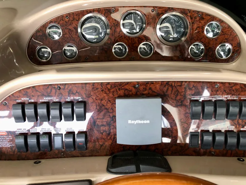 Slide: The Image of Control panel of a 2002 Sea Ray 360 Sundancer boat with Raytheon equipment. - 24