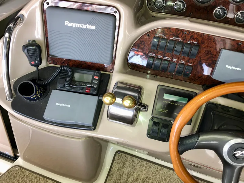 Slide: The Image of Control panel of a 2002 Sea Ray 360 Sundancer boat with Raymarine electronics. - 25