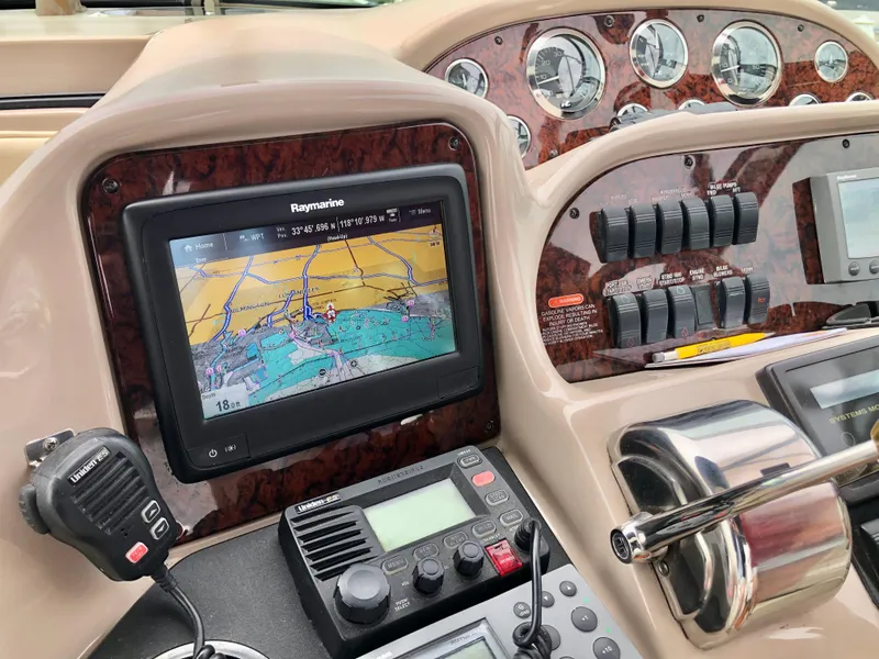 Slide: The Image of Sea Ray 360 Sundancer 2002 dashboard with navigation and control systems. - 26