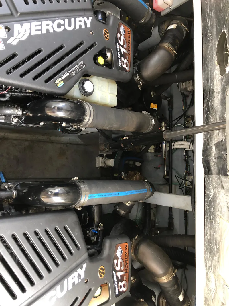 Slide: The Image of Engine compartment of a 2002 Sea Ray 360 Sundancer with twin Mercury 8.1S engines. - 48