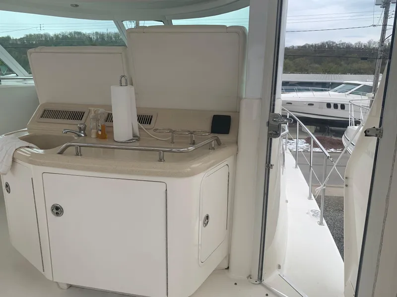 Slide: The Image of 2005 Sea Ray 390 Motor Yacht interior with kitchenette and sink. - 15