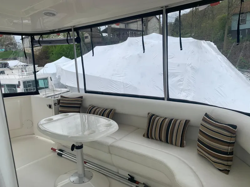 Slide: The Image of 2005 Sea Ray 390 Motor Yacht interior with seating and table. - 16