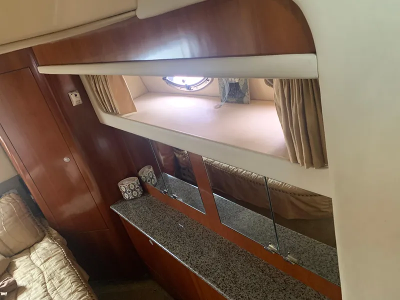Slide: The Image of Interior of 2005 Sea Ray 390 Motor Yacht with wooden cabinetry and granite countertop. - 26