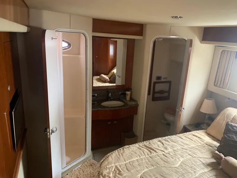 Slide: The Image of Interior cabin of 2005 Sea Ray 390 Motor Yacht with bed, bathroom, and shower. - 27