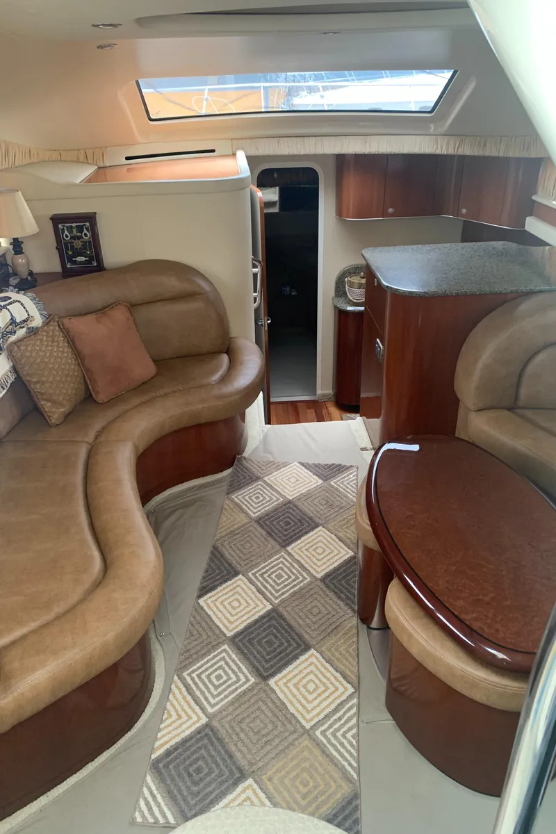 Slide: The Image of Luxurious interior of a 2005 Sea Ray 390 Motor Yacht with leather seating and wooden finishes. - 31