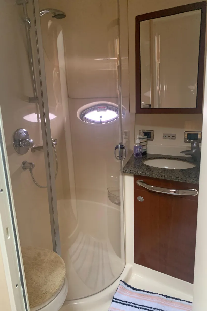 Slide: The Image of 2005 Sea Ray 390 Motor Yacht bathroom with shower, sink, and mirror. - 33