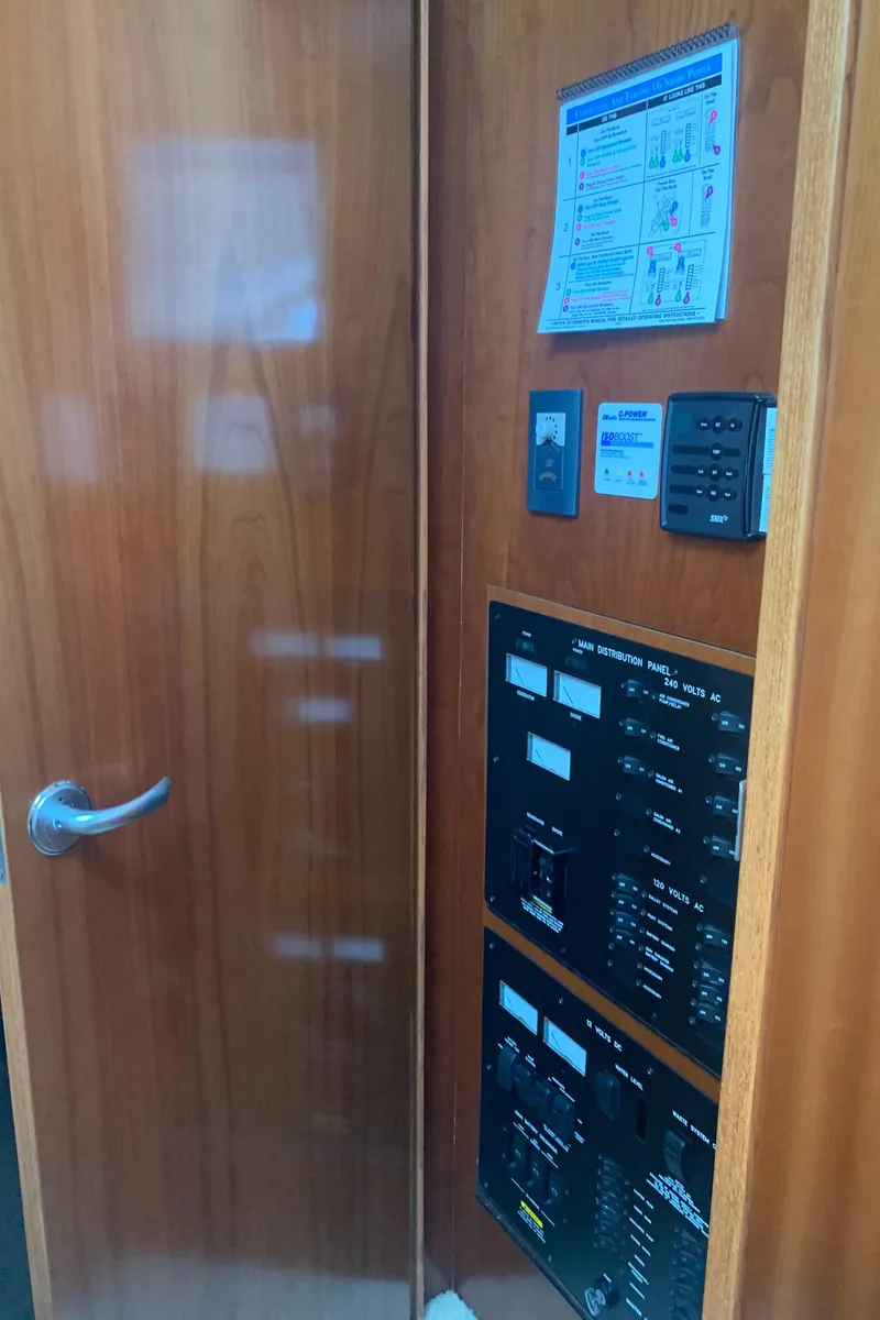 Slide: The Image of Control panel inside a 2005 Sea Ray 390 Motor Yacht with wooden door. - 41