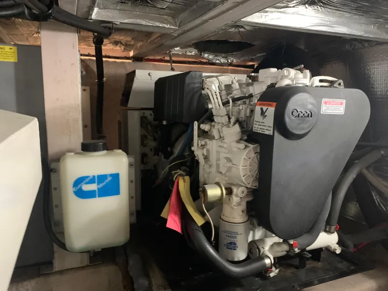 Slide: The Image of Engine room of a 2005 Sea Ray 390 Motor Yacht showing the generator. - 48