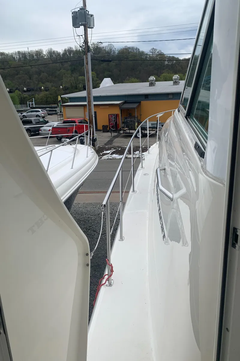 Slide: The Image of 2005 Sea Ray 390 Motor Yacht side deck view at marina. - 7