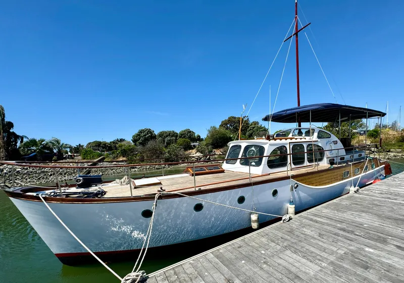 Slide: The Image of Classic 1966 Rampart 48 yacht "Sabi Star" docked at marina. - 4