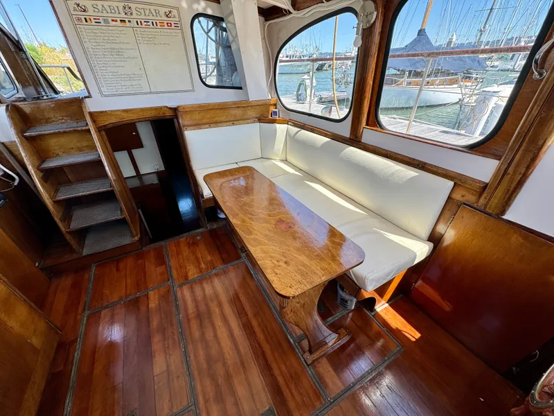 Slide: The Image of Vintage 1966 Rampart 48 boat interior with wooden helm and nautical instruments. - 8