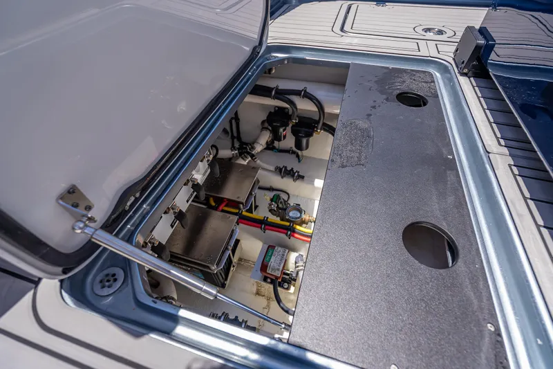 Slide: The Image of Open engine compartment of 2024 Nor-Tech 400 Supersport boat, showcasing internal components. - 31