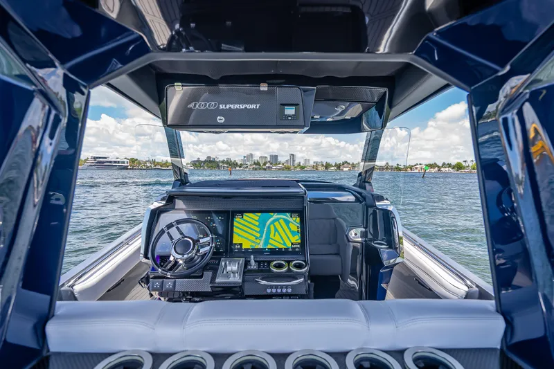 Slide: The Image of 2024 Nor-Tech 400 Supersport boat interior with advanced navigation system and luxurious seating. - 36