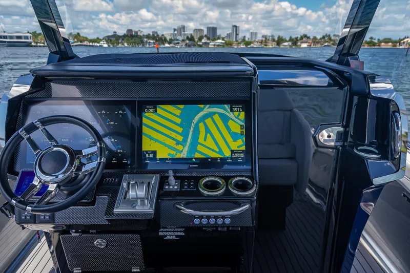 Slide: The Image of 2024 Nor-Tech 400 Supersport dashboard with advanced navigation system and steering wheel. - 37