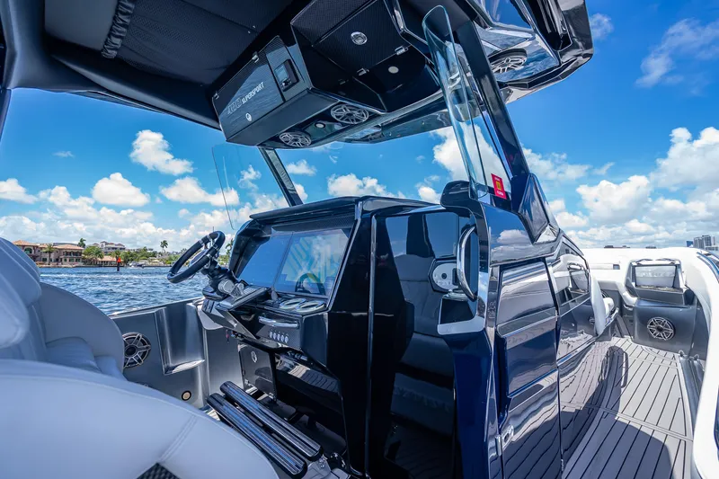 Slide: The Image of 2024 Nor-Tech 400 Supersport boat interior with sleek dashboard and steering wheel. - 39