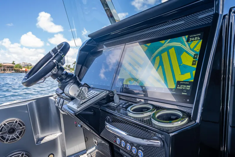 Slide: The Image of 2024 Nor-Tech 400 Supersport dashboard with GPS navigation and steering wheel. - 42