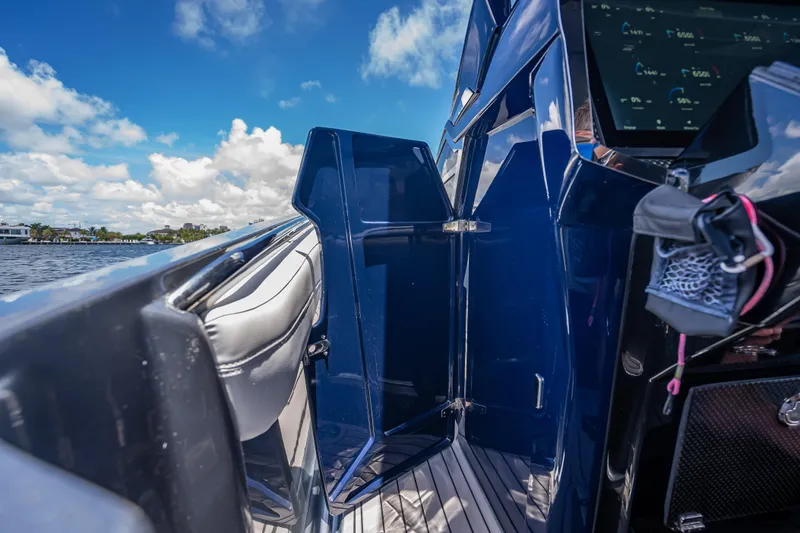 Slide: The Image of 2024 Nor-Tech 400 Supersport boat interior with sleek design and advanced dashboard. - 62