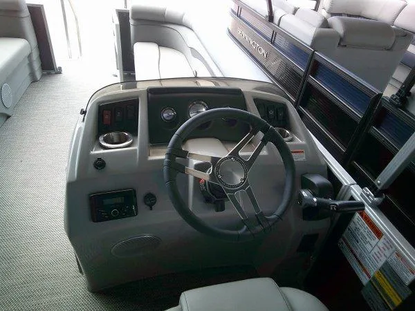 Slide: The Image of 2024 Bennington 208SLJ boat interior with steering wheel and control panel. - 3