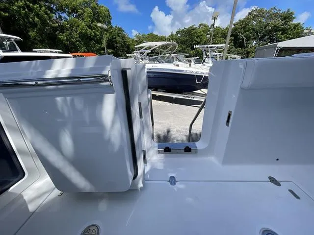 Slide: The Image of 2023 Blackfin 302CC boat interior with open side door. - 11