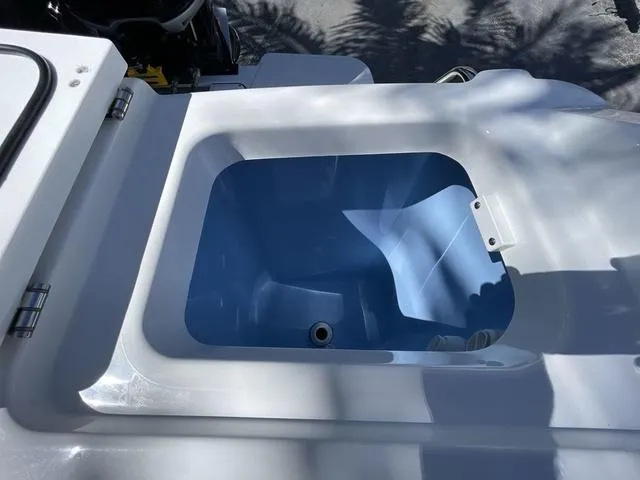 Slide: The Image of 2023 Blackfin 302CC boat livewell with blue interior. - 14