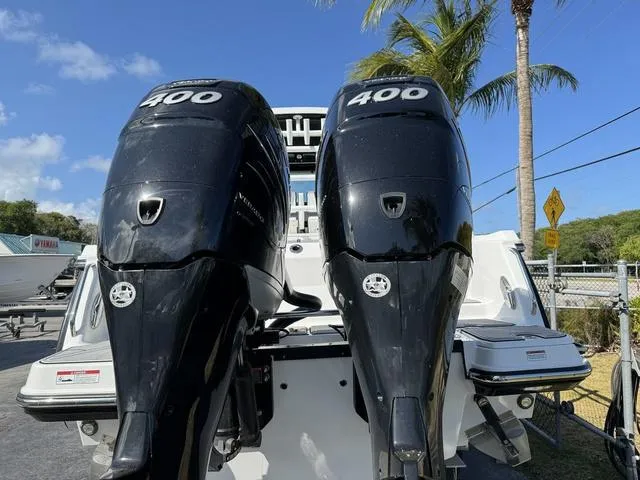 Slide: The Image of 2023 Blackfin 302CC boat with twin 400 horsepower engines. - 2