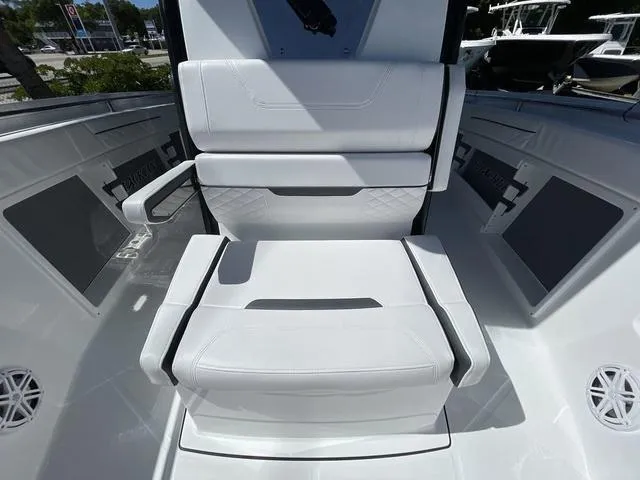 Slide: The Image of 2023 Blackfin 302CC boat interior with white cushioned seating. - 20