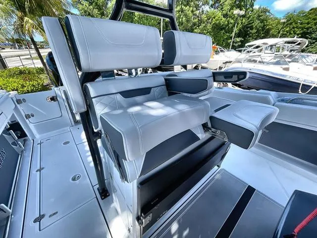 Slide: The Image of 2023 Blackfin 302CC boat interior with luxurious seating and modern design. - 22