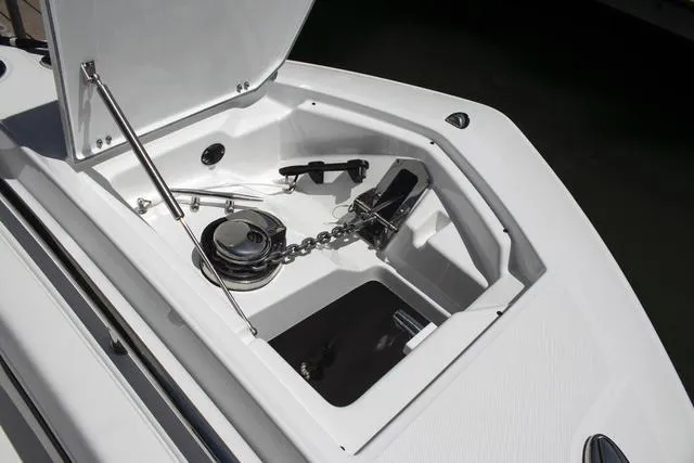 Slide: The Image of 2023 Blackfin 302CC anchor storage compartment with chain and windlass. - 29