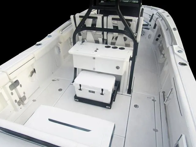 Slide: The Image of 2023 Blackfin 302CC center console boat interior with seating and storage. - 43