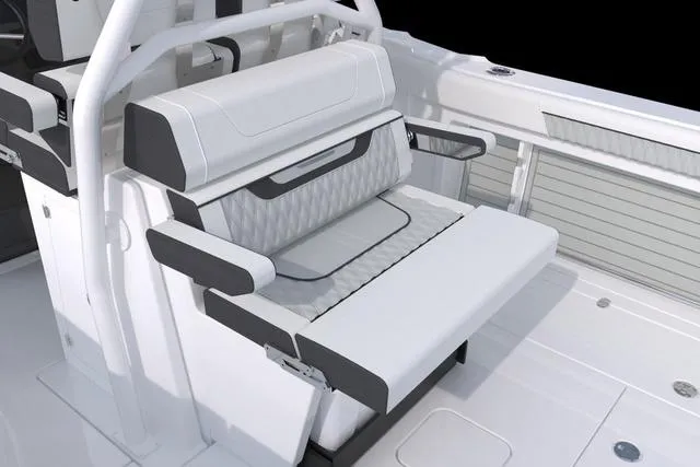 Slide: The Image of 2023 Blackfin 302CC boat interior seating with white and black cushioned bench. - 44