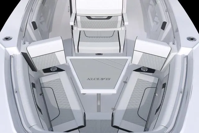 Slide: The Image of 2023 Blackfin 302CC boat interior with seating and table. - 45