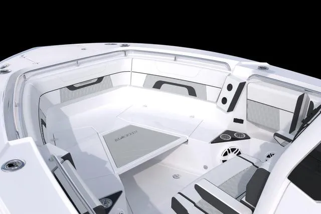 Slide: The Image of 2023 Blackfin 302CC boat interior with white and gray seating. - 46