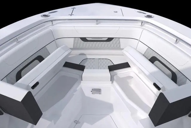 Slide: The Image of 2023 Blackfin 302CC boat interior with cushioned seating and storage compartments. - 47