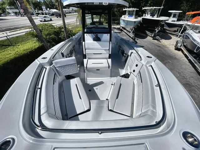 Slide: The Image of 2023 Blackfin 302CC center console boat with spacious seating and modern design. - 5