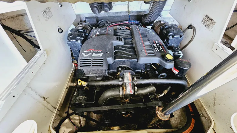Slide: The Image of Engine compartment of a 2000 Sea Ray 260 Bow Rider boat with a V8 engine. - 18