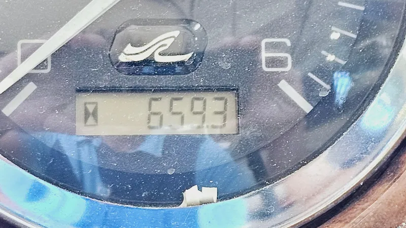 Slide: The Image of Close-up of Sea Ray 260 Bow Rider 2000 boat gauge showing 659.3 hours. - 19