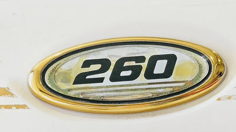 Slide: The Image of 2000 Sea Ray 260 Bow Rider emblem with gold trim - 20
