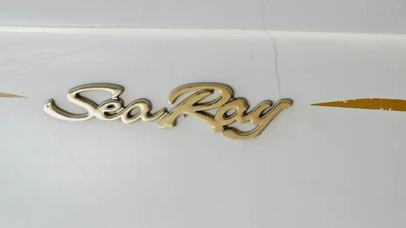 Slide: The Image of Sea Ray 260 Bow Rider 2000 model logo on white boat hull - 21