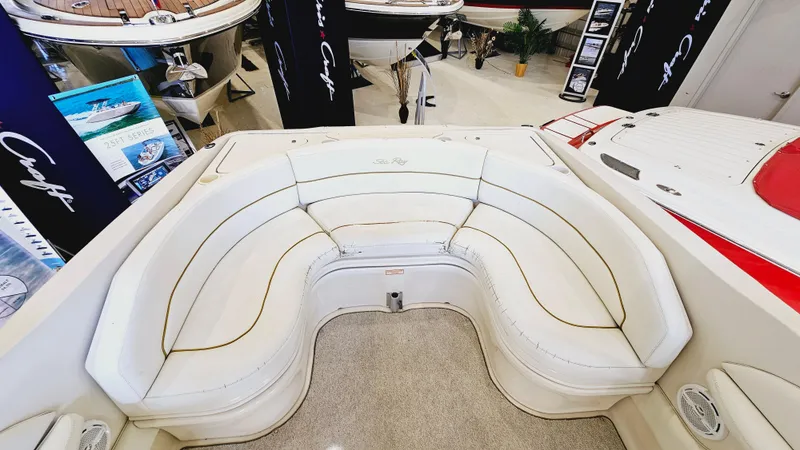 Slide: The Image of Interior seating of a 2000 Sea Ray 260 Bow Rider boat in showroom. - 7