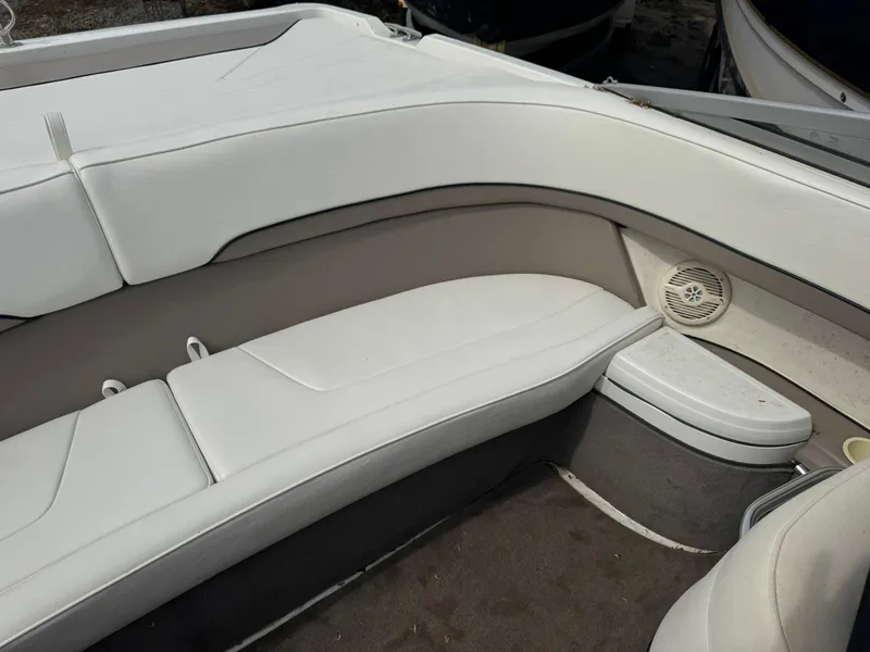 Slide: The Image of Interior of a 2000 Cobalt 252 boat with white seating and speaker. - 10