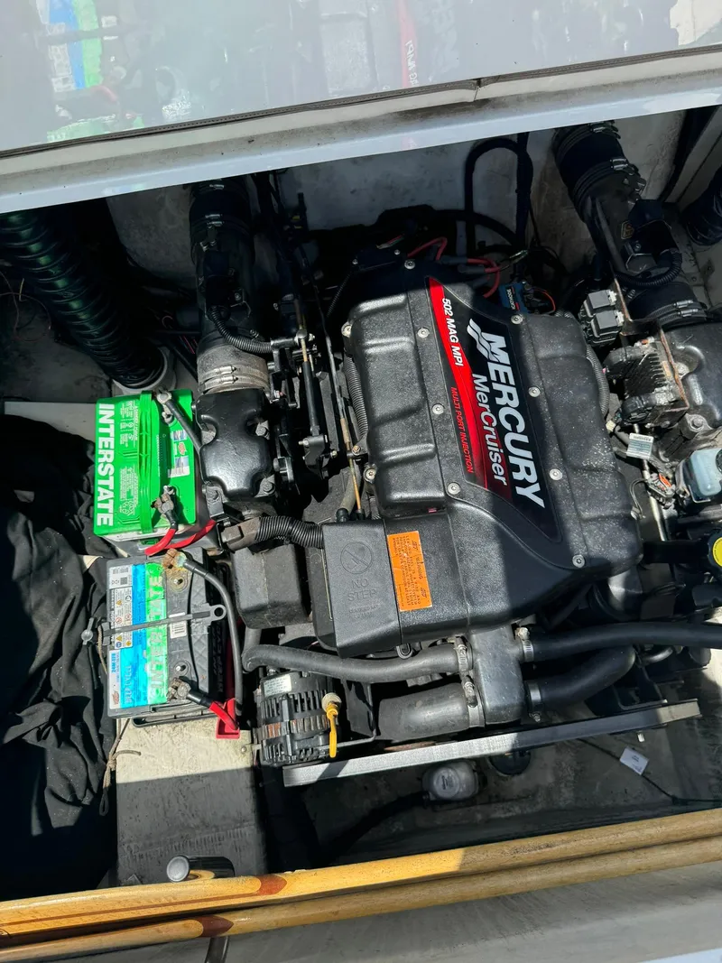Slide: The Image of 2000 Cobalt 252 boat engine compartment with Mercury MerCruiser engine and Interstate battery. - 16