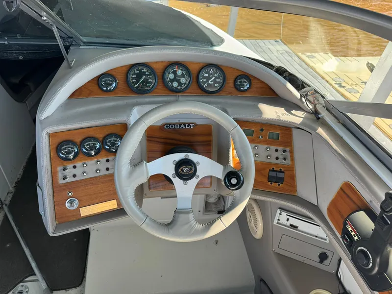 Slide: The Image of Cobalt 252 boat dashboard with steering wheel and instrument panel, 2000 model. - 6