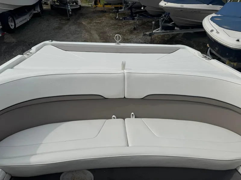 Slide: The Image of Cobalt 252 boat interior seating, 2000 model, featuring white cushioned seats. - 8