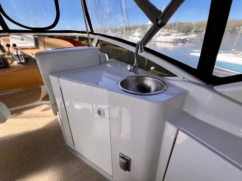Slide: The Image of 2002 Carver 396 Motor Yacht interior with sink and cabinetry. - 11
