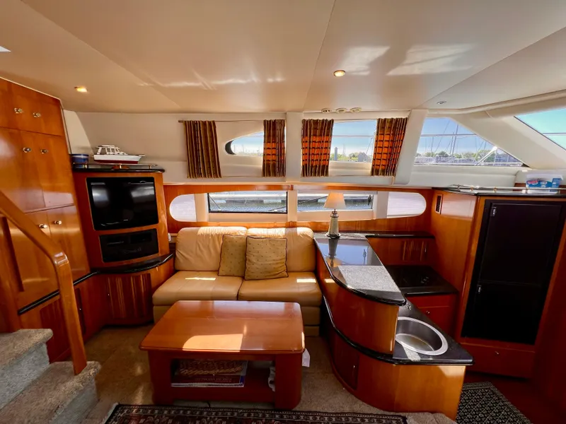 Slide: The Image of Luxurious interior of 2002 Carver 396 Motor Yacht with cozy seating and modern amenities. - 15