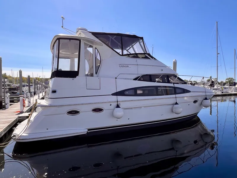 Slide: The Image of 2002 Carver 396 Motor Yacht docked at a marina. - 3