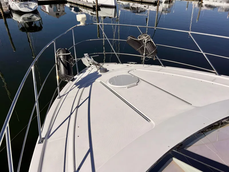 Slide: The Image of Bow of a 2002 Carver 396 Motor Yacht docked at a marina. - 5